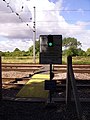 The red and green stop light at an MWL foot crossing near Offord Cluny, Cambridgeshire. This is a major crossing across the high speed East Coast Main Line