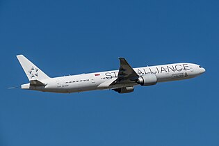 Singapore Airlines Boeing 777-300ER in Star Alliance livery with white tail.