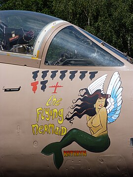 A Blackburn Buccaneer of the British Royal Navy with its nose art and victory markings.