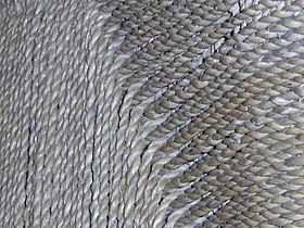 Detail of woven fibers of a carpet