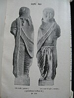 Statue of Magadhan king Udayin wearing drapes.