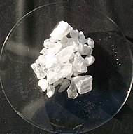 White crystals of alum on a glass-like plate