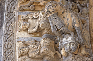 Details of the portal of Oloron Cathedral show a demon, a lion swallowing a man and kings with musical instruments.