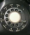 Image 25A traditional North American rotary phone dial. The associative lettering was originally used for dialing named exchanges but was kept because it facilitated memorization of telephone numbers.