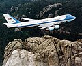 Air Force One, the typical air transport of the President of the United States, flying over Mount Rushmore.