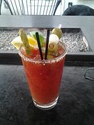 A Bloody Mary with several garnishes