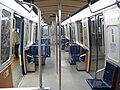 Interior of an MR-73 train showing the two panel pocket door to the right