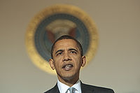 Barack Obama s klasickou kompozicí s kruhovým symbolem za hlavou