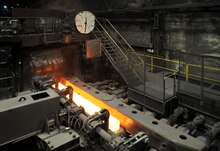 Hot bar of steel in a mill