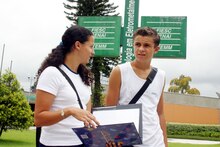 Brazilian students walking through their high school campus.