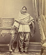 Portrait of a girl from Karachi, Sindh, in narrow Sindhi suthan and paro. c. 1870.