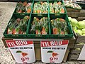 Carrots on display in returnable plastic bins