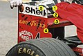 The rear wing of a modern Formula One car, with three aerodynamic elements (1, 2, 3). The rows of holes for adjustment of the angle of attack (4) and installation of another element (5) are visible on the wing's endplate.