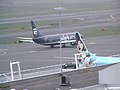 Alaska Airlines ".com" and "Disney" aircraft at PDX