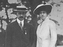 Frances and her husband stand side by side