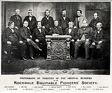 1865 photograph of 13 of the Rochdale Pioneers, who in 1844 established the Rochdale Society of Equitable Pioneers.