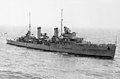 Large World War II-era warship at sea