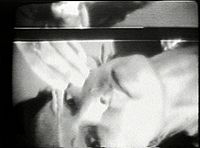 Joan Jonas during a performance documented on video and installed, 1972