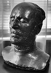 A black statue of a man's face