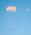 The Soyuz TMA-21 capsule descends toward landing.