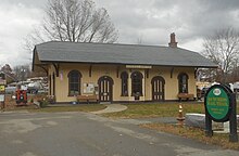 A wooden railway station building