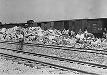 Photograph of prisoners sorting confiscated property at Auschwitz II-Birkenau