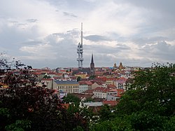Žižkov as seen from Vítkov hill, with Žižkov Television Tower and St. Procopius church