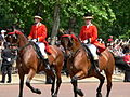 Outriders from the Royal Mews, wearing scarlet livery