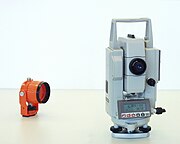 A laser tachymeter and surveying prism made by Sokkia