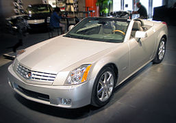 Cadillac XLR c. 2007, with fully retracted aluminum (i.e., lightweight) hardtop concealed by self-storing tonneau cover, the hardtop manufactured by a supplier joint venture of Mercedes-Benz and Porsche[32]