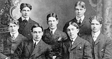 Seven young men lined up for a photo.