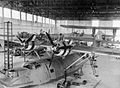 Catalina I of 205 Sqn undergoing servicing in their hangar at RAF Seletar. One of the squadron's Short Singapore Mk III biplane flying boats can be seen in the right background.