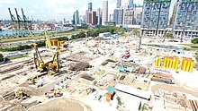 Aerial view of the construction site with construction machinery and vehicles