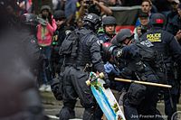 An officer with the SERT team, along with Federal Protective Service agents, responding to protest in Downtown Portland in 2017.