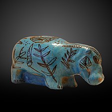 A hippopotamus decorated with aquatic plants, made of faience with a blue glaze, made to resemble lapis lazuli. (2033–1710 BC)