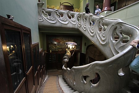 Full view of the stairway and Medusa lamp