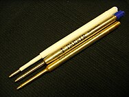 Three stacked pen refills with similar fittings for comparison