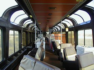 Railcar interior with floor-to-ceiling windows
