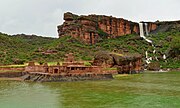 Bhutanatha temple complex at Badami, next to a waterfall, during the monsoon.