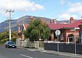 A view of Cross Street, New Town, with backdrop of Mount Wellington