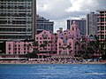 The Royal Hawaiian Hotel in Honolulu, Hawaii, built in 1927, was the first hotel on Waikiki Beach. Its pink color was designed to match an exotic setting, and to contrast with the blue of the sea and green of the landscape.