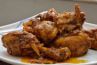 Chicken kasha is a dry chicken curry from Bengal