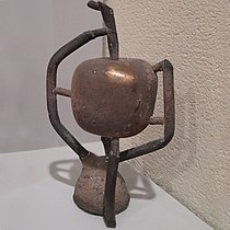 The sculpture of the apple, just extracted from its mould. Below is the funnel through which the bronze was poured (upside down). This is the last step of the lost-wax casting process