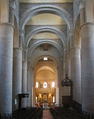 The Church of St Philibert, Tournus, (990–1019) has tall circular piers supporting the arcade and is roofed with a series of barrel vaults supported on arches. Small clerestory windows light the vault.