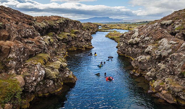 Snorkeling in the Silfra canyon, a rift between the tectonic plates (North American and Eurasian), Þingvellir National Park, Southern Region, Iceland.