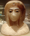 Close-up of an Egyptian alabaster canopic jar thought to depict a likeness of Kiya, from tomb KV55 - on display at the Metropolitan Museum of Art