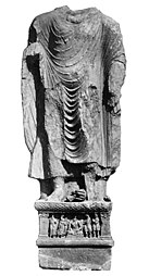 Kanishka I: Buddha from Loriyan Tangai with inscription mentioning the "year 318" of the Yavana era (AD 143).[124]