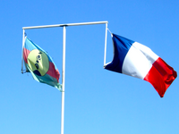New Caledonia has two flags, flown here in Nouméa, the capital city, on a single flagpole with a crossbar