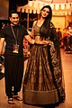 Sonal Chauhan in a paneled lehenga with Shantanu Goenka at Lakme Fashion Week
