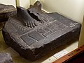 Fragment of the base of a basalt statue dated to the Late Period, the Nine Bows being beneath the feet of the subject of the statue